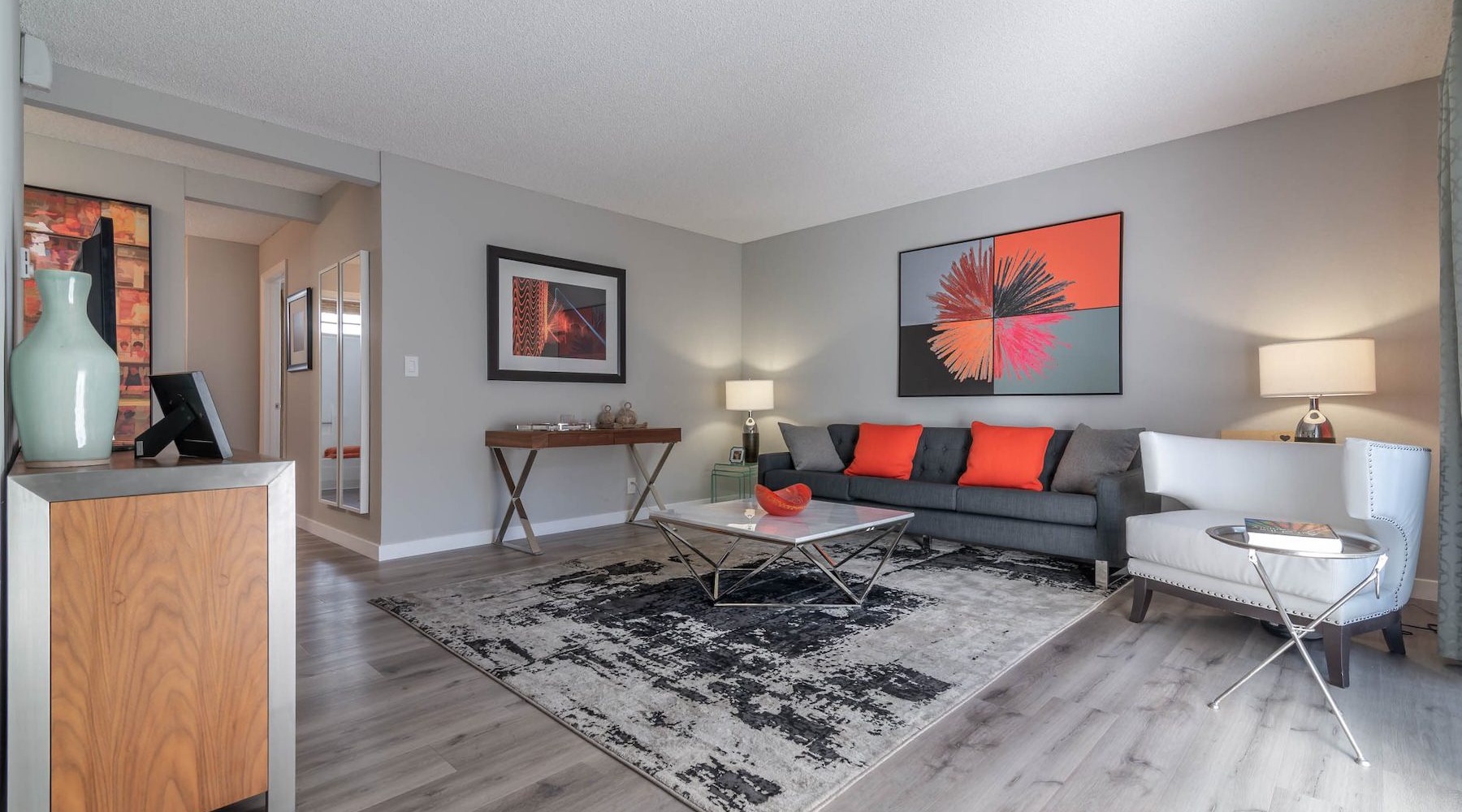 a living room with a couch and a chair