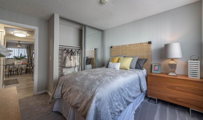 a bedroom with a bed and a nightstand